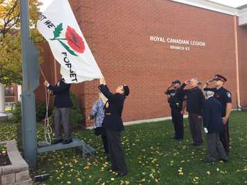 Branch 62 members, Sarnia police officers and Mayor Mike Bradley  gather to raise a Lest We Forget Flag. November 1, 2016 BlackburnNews.com photo by Melanie Irwin