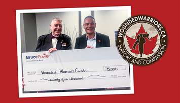 Bruce Power President and Chief Executive Officer Eric Chassard, right, presents a cheque for $75,000 to Philip C. Ralph of Wounded Warriors Canada on behalf of the company's supplier partners. Photo from Bruce Power