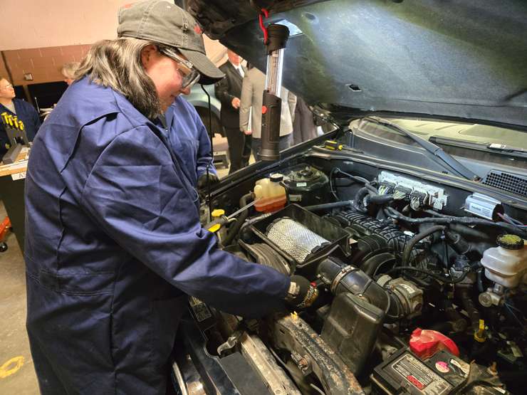 A student in the Women Ready to Work in Automotive pre-apprenticeship training program works on a car engine - Sept. 9/25 (Blackburn Media Photo by Josh Boyce)