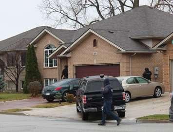 Windsor police ESU surround house in east Windsor to serve an outstanding arrest warrant, December 1, 2015. (Photo by Maureen Revait) 
