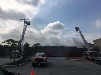 Windsor fire crews continue battling a stubborn blaze at the Gel Tech plant in Walkerville. (Photo by Paul Pedro)