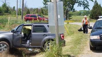 Vehicle hits the ditch at Queens St. and Lakeshore Rd. near Camlachie June 29, 2015 (BlackburnNews.com Photo by Briana Carnegie)