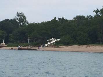 Police respond after a boat crashes into the shore near Canatara Park Beach, July 3, 2015. (Photo by Sue Storr)