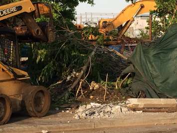 A truck knocks down two hydro poles and smashes through a fence on Drouillard just north of Franklin St., June 10, 2015. (Photo by Jason Viau)