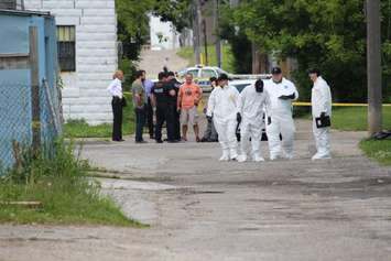 Police investigate an apparent homicide in the 500 block of Brant St., June 4, 2015. (Photo by Jason Viau)