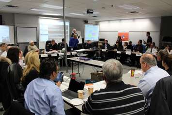 Officials from the City of Windsor, police, fire, Enwin, the provincial government and more, discuss an emergency scenario at Windsors EOC, February 24, 2015. (Photo by Mike Vlasveld)