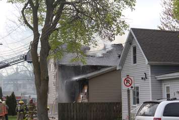 Firefighters battle a house fire in the area of Grant Street and Chatham Street in Chatham, May 8, 2019. (Photo by Allanah Wills) 