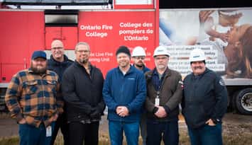 Representatives from BASES, Sarnia Fire Rescue Service, Aamjiwnaang Emergency Management, and TransAlta gather while members of Sarnia Fire Rescue participate in live fire training at TransAlta. Submitted photo.      