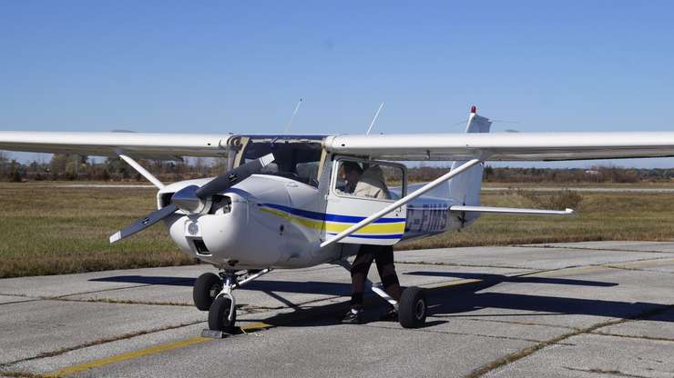 Lincoln Preiss doing a safety check before taking off from Sarnia Chris Hadfield Airport. October 27, 2025. (Photo by Natalia Vega) 