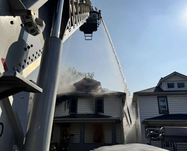 A Windsor Fire aerial truck shoots water on a blaze on Campbell Avenue, July 14, 2025. Photo courtesy Windsor Fire and Rescue/X.