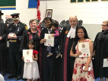 The Alloji family takes the oath of citizenship at St. Patrick's High School in Sarnia. May 8, 2018 (Photo by Melanie Irwin)