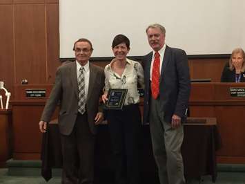 Councillor Dave Boushy and Mayor Mike Bradley present Kathy Alexander with a 2017 Accessibility Award. October 2, 2017 (Photo by Melanie Irwin)