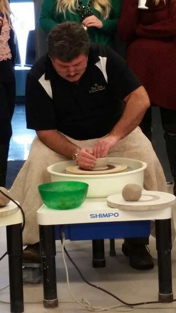 Inn of the Good Shepherd's Myles Vanni tries his hand at pottery at Lambton College. January 12, 2015 (BlackburnNews.com photo by Jake Jeffrey)