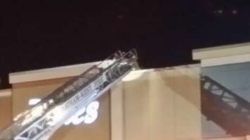 Crews look to see if fire has extended into the roof of Pennington's (Photo taken by Jake Kislinsky)