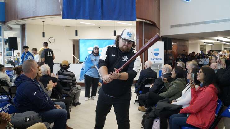 Lambton College students showcase merchandise from the newly expanded campus shop. November 2, 2023. (Photo by Natalia Vega)