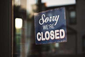 "Sorry We're Closed" sign. (Photo by Tim Mossholder from Pexels)