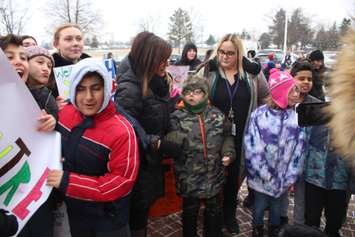 Huntre Allard, 9, is escorted into Our Lady of Perpetual Help School in Windsor by teachers and classmates on February 11, 2019. Photo by Mark Brown/Blackburn News.