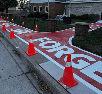 A painted sidewalk honouring local veterans is seen outside the Royal Canadian Legion 255 in Windsor, October 24, 2025. Photo by Matt Franklin.