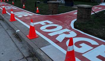 A painted sidewalk honouring local veterans is seen outside the Royal Canadian Legion 255 in Windsor, October 24, 2025. Photo by Matt Franklin.