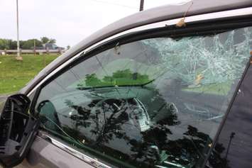 A heavily damaged vehicle sits near the EC Row Expressway and Central Avenue in Windsor on August 25, 2016 after a tornado ripped through the area, causing heavy damage. (Photo by Ricardo Veneza)