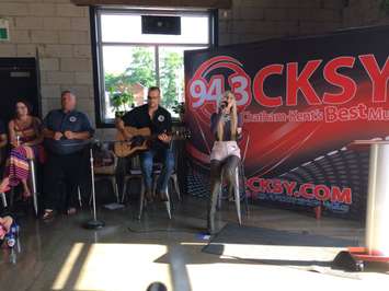 Brooklyn Roebuck of Chatham-Kent singing Positivity Day jingle. July 26, 2017. (Photo by Paul Pedro)