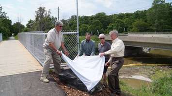 Unveiling the memorial for Ron Yorke at the newly renovated bridge on Howard Watson Nature Trail. June 29, 2015 (BlackburnNews.com Photo by Briana Carnegie)