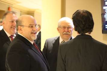 Amherstburg Deputy Mayor Bart DiPasquale (L), Essex Mayor Ron McDermott (C) and Amherstburg Mayor Aldo DiCarlo (R) chat as they wait to be led into the inaugural meeting of Essex County Council at the Ciociaro Club on December 10, 2014. (Photo by Ricardo Veneza)