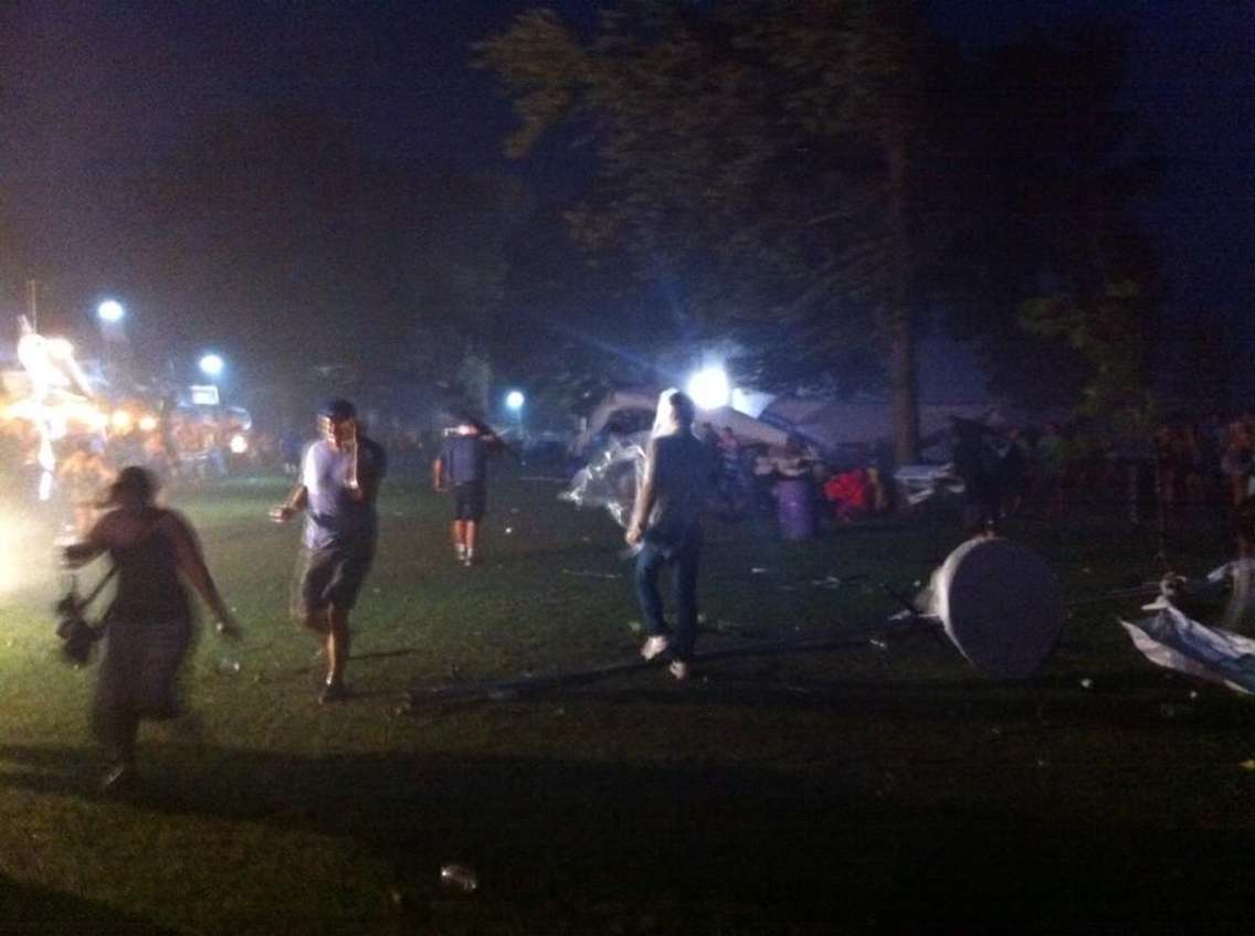 Festival-goers flee the Shores of Erie International Wine Festival during an intense storm, September 5, 2014. (Photo by Kevin Black)