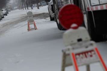 Windsor police detectives canvass the Benjamin Ave. area on January 21, 2015 where a pregnant woman was murdered on December 11, 2014. (Photo by Jason Viau)