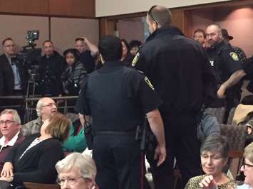 Sarnia Police escort a man out of Sarnia City Hall. Monday, October 24, 2016. BlackburnNews.com photo by Melanie Irwin