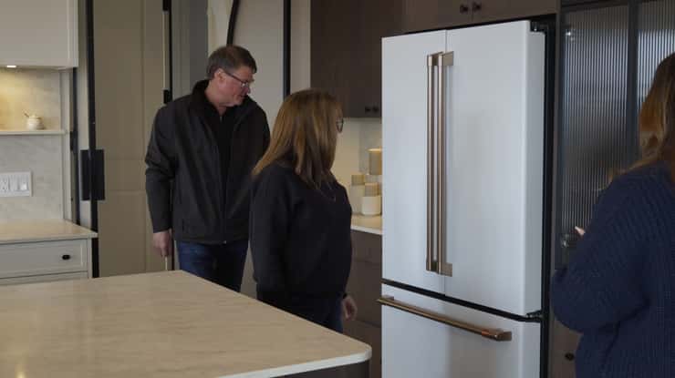 Sharon and Jim Jardine tour the fully furnished $1.46 million dream home. February 20, 2025. (Photo by Natalia Vega)