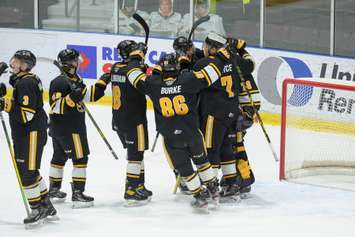 The Sarnia Sting celebrate a win versus the Flint Firebirds. 8 January 2022.  (Metcalfe Photography)