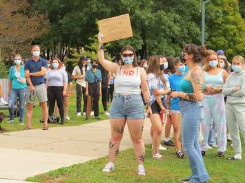 A Western student holds a sign during a walkout in support of survivors of sexual violence at Western University, September 17, 2021. (Photo by Miranda Chant, Blackburn News)