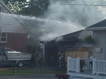 Firefighters respond to a garage fire on Indian Rd. in Sarnia, May 26, 2016. (Photo courtesy of Aaron Zimmer)
