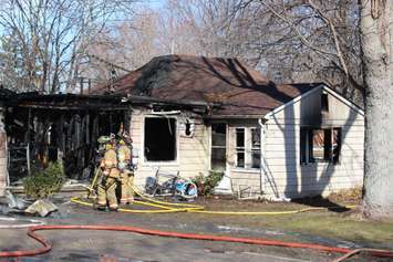 Essex firefighters battle a residential blaze in the 100-block of Park St. in Harrow, March 18, 2015. (Photo by Mike Vlasveld)