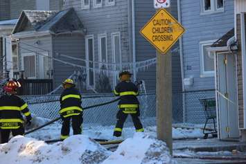 Firefighters at the scene of two house fires in the 800-block of Assumption St. in Windsor March 2, 2015. (Photo by Adelle Loiselle.)