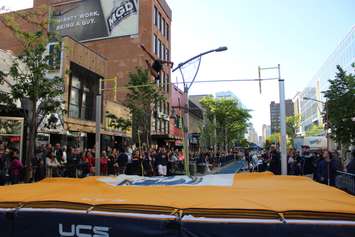 Athletes compete in a pole vaulting competition on Ouellette Ave., May 22, 2015. (Photo by Jason Viau)