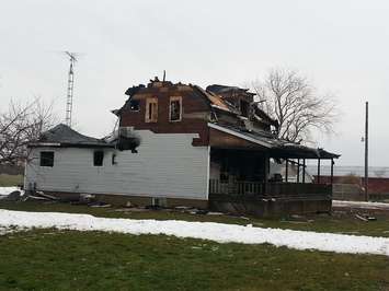 A home on Talbot Trail south of Blenheim was destroyed by fire on November 22, 2014. (Photo by Ashton Patis) 