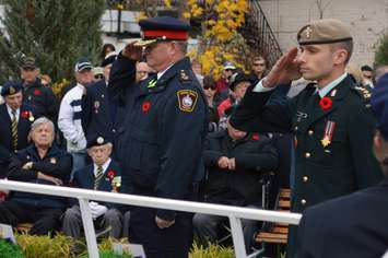 Saugeen Shores Police Chief Dan Rivett [left] salutes with his son,
Captain Tom Rivett after laying wreaths. (Photo-Jordan MacKinnon)