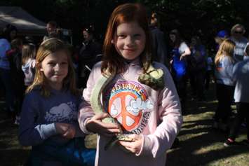 Merlin Area Public School Student Sophie Seguin holds a snake at the 11th Annual Chatham-Kent & Lambton Children’s Water Festival. (Photo by Millar Hill)