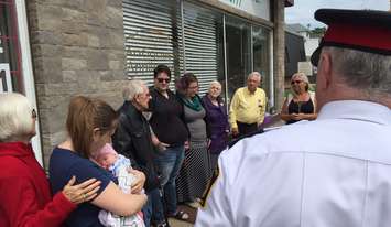 A small ceremony is held a Mitton and George Streets before purple ribbons are placed. May 24, 2017 (Photo by Melanie Irwin)