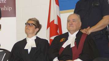 Justice George Springate (right) presides over a swearing in ceremony for new Canadians at St. Patrick's High School. May 3, 2017 (Photo by Melanie Irwin)