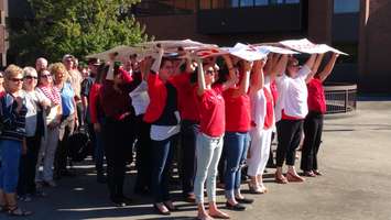 United Way Staff unveil their 2015 goal to a drone flying by in Chatham (Photo by Jake Kislinsky)