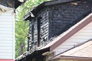 Police and fire officials investigate a fatal fire on Aubin Rd., August 12, 2015. (Photo by Jason Viau)