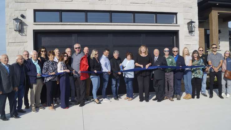 The ribbon being cut at the Bluewater Health Dream Home, Oct. 4, 2024 (Photo by: Lindsay Newman/ Blackburn Media)