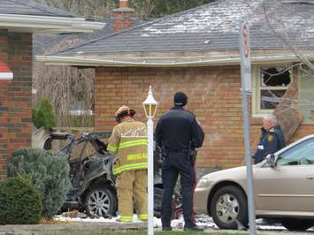 Fire officials investigate a vehicle explosion at a home on Wood St. in St. Thomas. (Photo by Miranda Chant, BlackburnNews.com)
