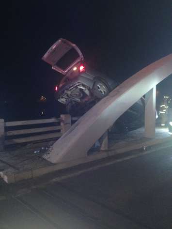 A vehicle collides with the River Canard bridge in Amherstburg, December 6, 2015. (Photo courtesy of the LaSalle Police Service)