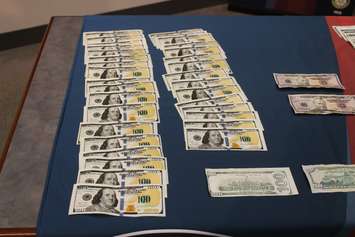 Counterfeit money found by the Windsor Police Service on display at media conference, December 1, 2015 (Photo by Maureen Revait) 