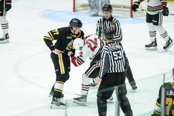 Sting defenceman Ethan Del Mastro squares off with Guelph's Ben McFarlane in Game 2 of the opening round playoff matchup. 2 April 2023. (Metcalfe Photography)