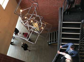 The new modern chandelier in the stairwell of Blyth Memorial Hall. (Photo by Ryan Drury)